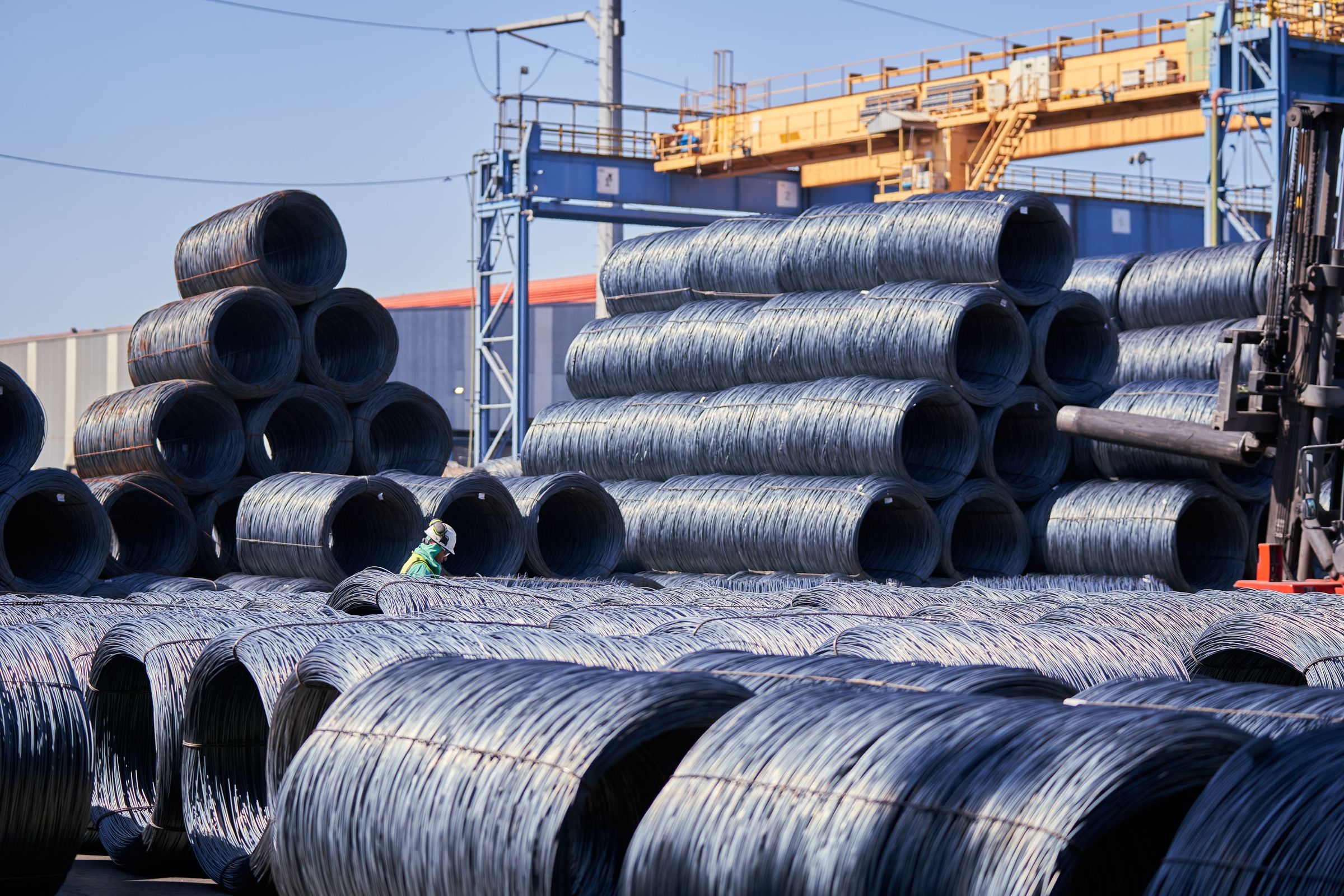 Steel stockyard with stacked iron rod coils